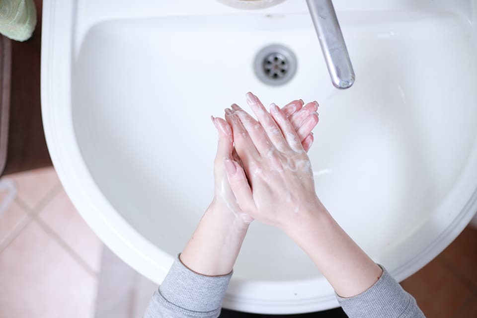 Washing hands at sink