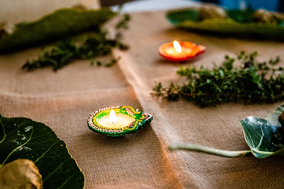 Two lit diyas on a table for Diwali in an early learning centre.