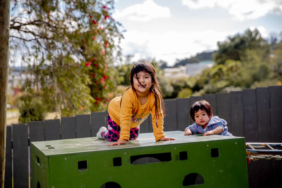 Mixed age siblings playing together at daycare Glen Eden