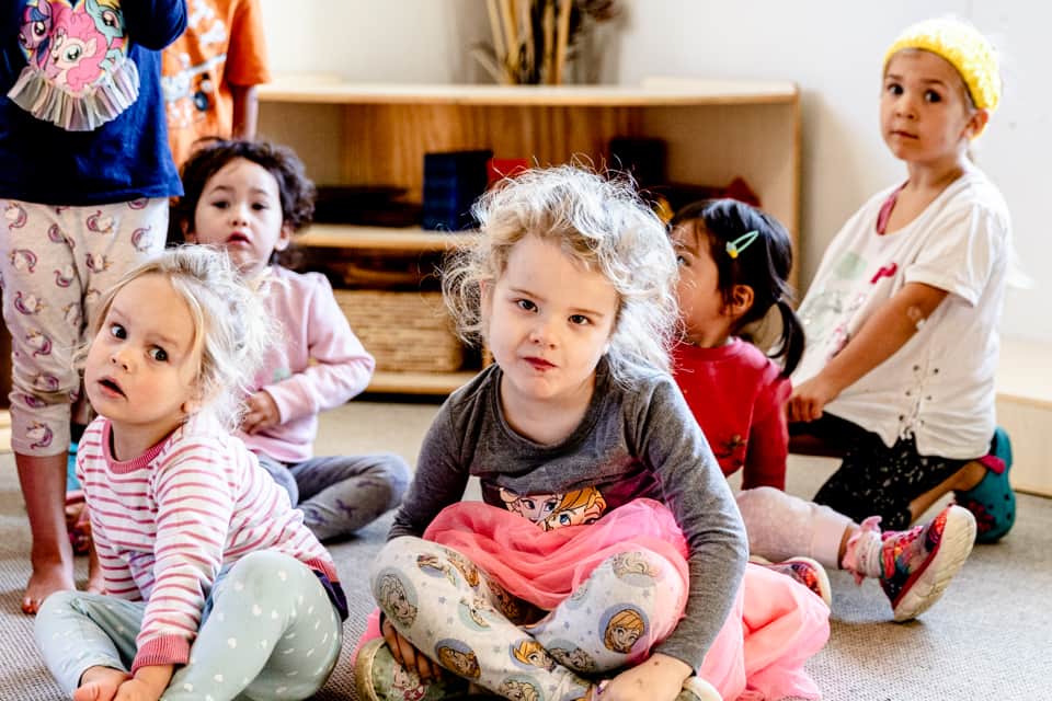 Group of children at mat time at daycare